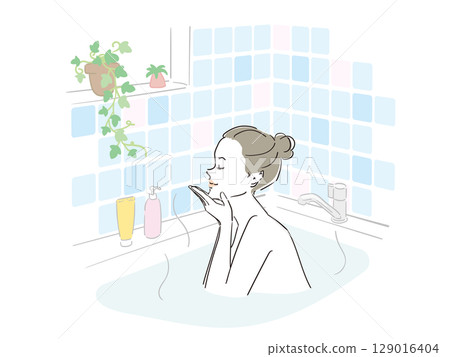 A beautiful woman taking a comfortable bath 129016404