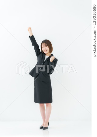 Business woman, young woman, whole body, fist pump Business woman, young woman, whole body, fist pump 129016680