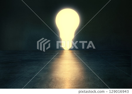 Glowing light bulb in dark empty room. 129016943