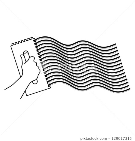 Notched trowel in hand applies waves of plaster glue 129017315