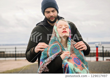 Affectionate lovers man and woman outdoors portrait 129017497