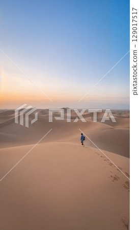 Vast Desert Landscape, Arid Beauty, Solitude, Self-Discovery. Ideal for adventurous travel, artistic expression, introspective journeys Vast Desert Landscape, Arid Beauty, Solitude, Self-Discovery. Ideal for adventurous travel, artistic expression, introspective journeys 129017517