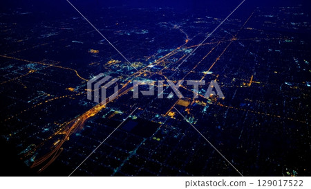 Aerial View of City from Plane, Urban Landscape, Global Perspective, Connected World. Ideal for urban planning, geography, economic development 129017522