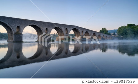 Ancient Bridge Over Misty River, Mystical Journey, Historic Crossroads, Timeless Passage. Perfect for historical travel, fantasy themes, philosophical concepts Ancient Bridge Over Misty River, Mystical Journey, Historic Crossroads, Timeless Passage. Perfect for historical travel, fantasy themes, philosophical concepts 129017559