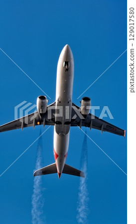 Airplane Takeoff, Dynamic Start, Ascent, Momentum. Ideal for motivational content, business launch, sports themes, vertical shot 129017580
