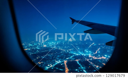 Night Flight over City, Tranquil Journey, Urban Glow, Serene View. Ideal for night travel, reflective moments, city lights Night Flight over City, Tranquil Journey, Urban Glow, Serene View. Ideal for night travel, reflective moments, city lights 129017679