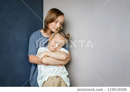 Cute children little girl and boy together at home. Sibling indoor, childhood concept 129018086