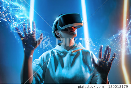 Woman with VR virtual reality goggles Woman with VR virtual reality goggles 129018179