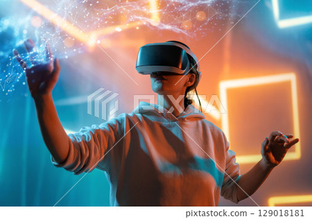 Woman with VR virtual reality goggles Woman with VR virtual reality goggles 129018181