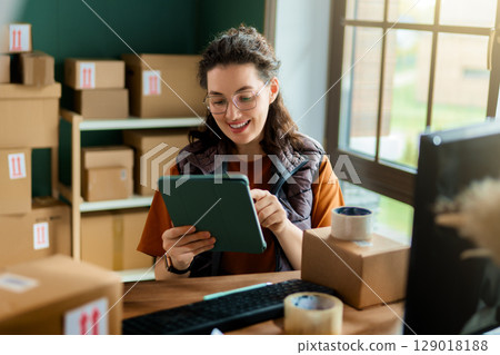 Woman working in a warehouse 129018188