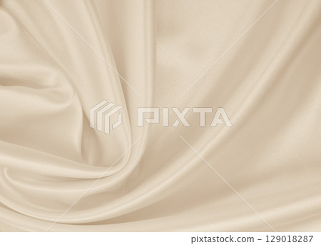 Smooth elegant golden silk or satin luxury cloth texture as wedding background. Luxurious background design. In Sepia toned. Retro style Smooth elegant golden silk or satin luxury cloth texture as wedding background. Luxurious background design. In Sepia toned. Retro style 129018287