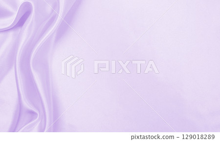 Smooth elegant lilac silk or satin texture as wedding background. Luxurious valentine day background design Smooth elegant lilac silk or satin texture as wedding background. Luxurious valentine day background design 129018289