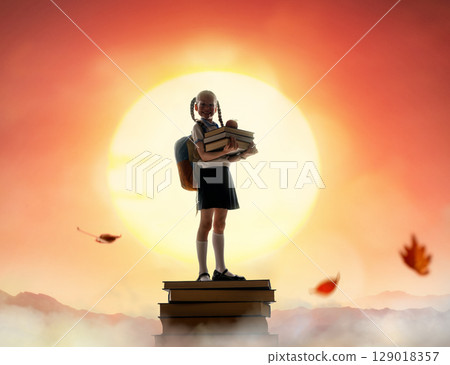 child on the tower of books child on the tower of books 129018357