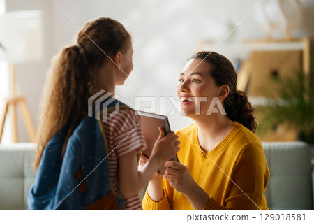 Happy family preparing for school Happy family preparing for school 129018581