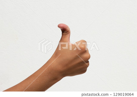 Child showing hypermobile thumb on white background Child showing hypermobile thumb on white background 129019064
