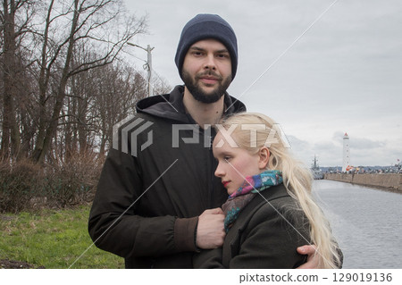 Blonde young woman with blond hair and handsome man outdoors. Happy couple 129019136