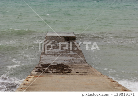 Breakwater structure coastal area to protect against tides, currents, waves, and storm surges Breakwater structure coastal area to protect against tides, currents, waves, and storm surges 129019171