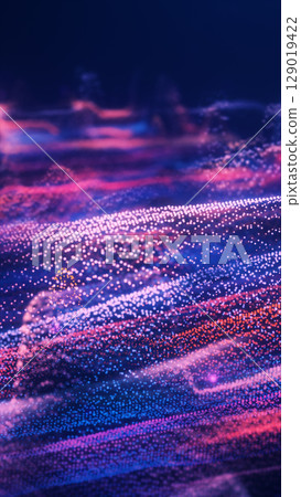 A sea of sparkling particles in purple and pink flows like waves, forming an abstract digital landscape 129019422