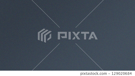 Grainy dark grey textured background with subtle noise effect 129020684