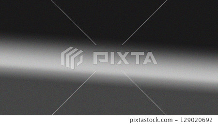 Black and white gradient grainy background with soft transitions and minimal noise texture. Neutral abstract design for creative projects 129020692