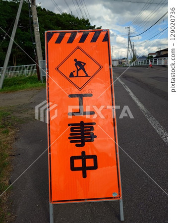 Sign under construction (vertical photo) 129020736