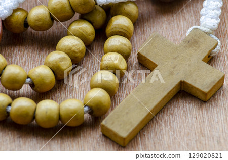 Close Up Of Wooden Rosary With Beads And Cross 129020821