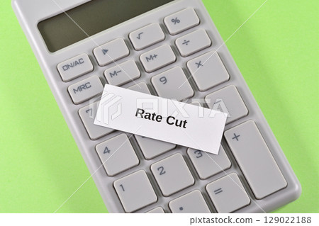 Image of interest rate cut with calculator and rate cut 129022188