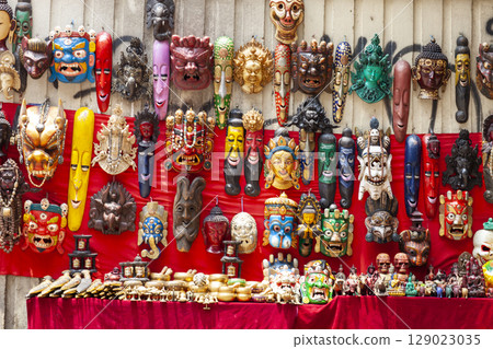 Traditional Masks Of Nepal For Sale At A Souvenir Kiosk In Kathmandu. Traditional Masks Of Nepal For Sale At A Souvenir Kiosk In Kathmandu. 129023035
