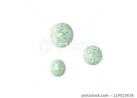 Drops of a green body scrub with particles 129023636