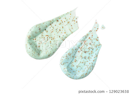 Smears of a green body scrub with particles 129023638