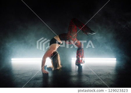 Long Haired Sexy Woman Performs Erotic Movements With Body On Floor. Seductive Long Haired Sexy Woman Performs Erotic Movements With Body On Floor. Seductive 129023823
