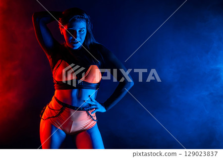 Pretty Young Woman Dancing Twerk, Sexual Body Movements. Shaking Long Hair, Neon Pretty Young Woman Dancing Twerk, Sexual Body Movements. Shaking Long Hair, Neon 129023837