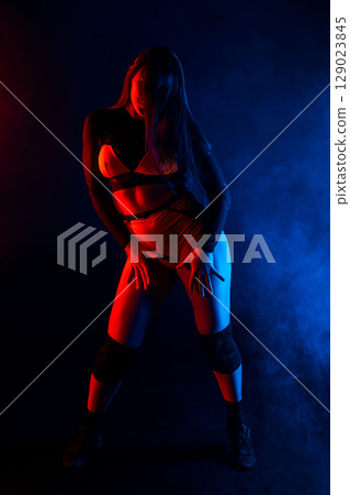 Pretty Young Woman Dancing Twerk, Sexual Body Movements. Shaking Long Hair, Neon 129023845