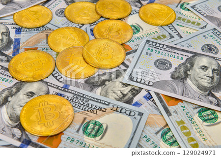 Bitcoin coins Crypto currency and paper money100 US dollar bills , virtual currency. Finance and investment concept. Bitcoin coins Crypto currency and paper money100 US dollar bills , virtual currency. Finance and investment concept. 129024971