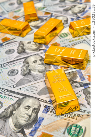 Paper us 100 dollar bill with gold bars, concept of investment and saving, wealth 129025119