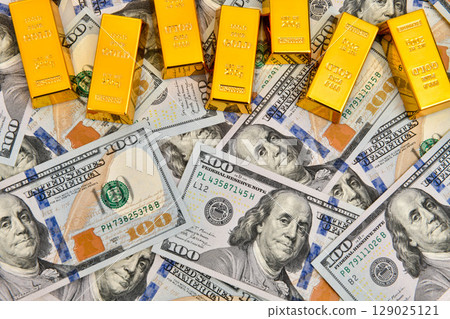 Paper us 100 dollar bill with gold bars, concept of investment and saving, wealth 129025121