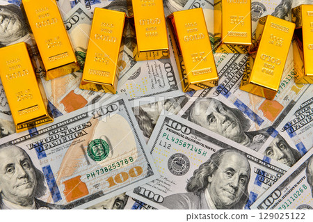 Paper us 100 dollar bill with gold bars, concept of investment and saving, wealth 129025122