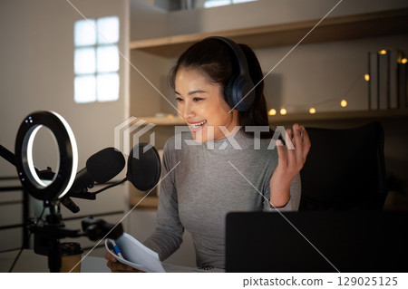 Joyful podcast host sharing insights from her home studio 129025125