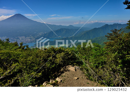 View of Mt. Fuji, Lake Kawaguchi, and the Misaka Mountains in summer from the Kurodake Observatory in the Misaka Mountains 129025432