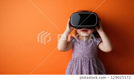 toddler girl experiencing virtual reality 129025572