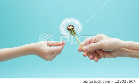 grandmother giving dandelion to child 129025604