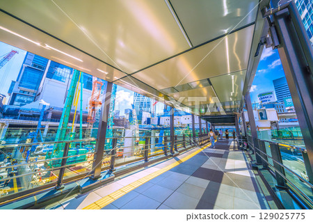 Tokyo cityscape, Japan, July 26th. Extreme heat...huge heavy machinery lined up...goodbye, Shibuya Station West Exit. Full-scale construction begins. 129025775