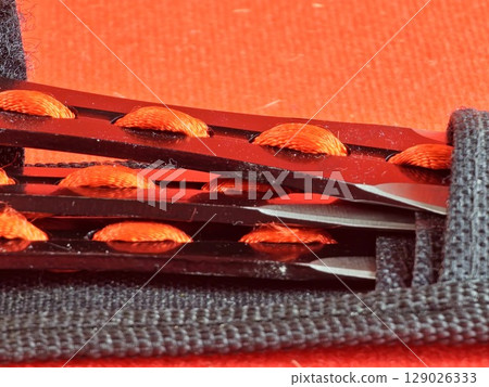 Close-up of throwing knife handles in case for combat training and sport throwing 129026333