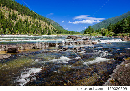 Clear Water Flowing Over Rocks in River moutain 129026809