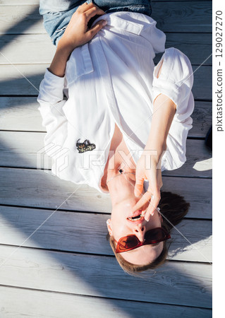 Portrait of a 40-year-old woman in a shirt Portrait of a 40-year-old woman in a shirt 129027270