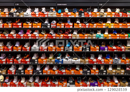 Kyiv, Ukraine - 28th March, 2025 Nike shop A Vibrant Display of Athletic Footwear: An Array of Sneakers and Sports Shoes on Shelves Ready for Fashion-forward Shoppers in a Retail Store Environment 129028539