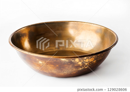 Empty gold pan is shown with gold specks, suggesting someone was recently using it 129028606