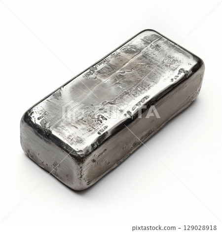 Shiny steel ingot on white surface, reflecting light and shadow, emphasizing texture and solidity. Perfect for industrial concepts 129028918