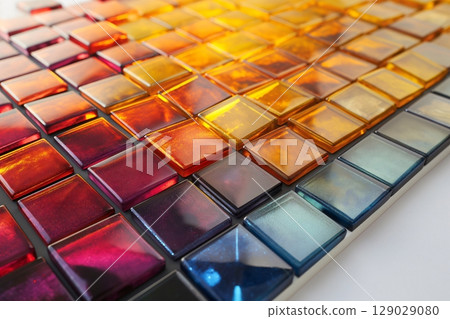 Vibrant mosaic tiles create a colorful gradient, perfect for adding style to any space. Shiny glass reflects light beautifully, highlighting the geometric pattern 129029080