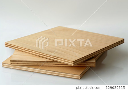 Stack of plywood sheets is creating an abstract composition on a white background 129029615